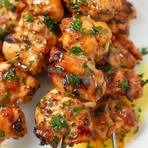 Crispy air fryer chicken skewers served on a plate, ideal for busy moms.