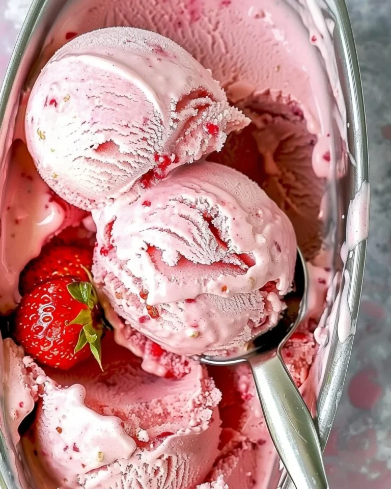 No-Churn Strawberry Ice Cream served in a bowl with fresh strawberries.