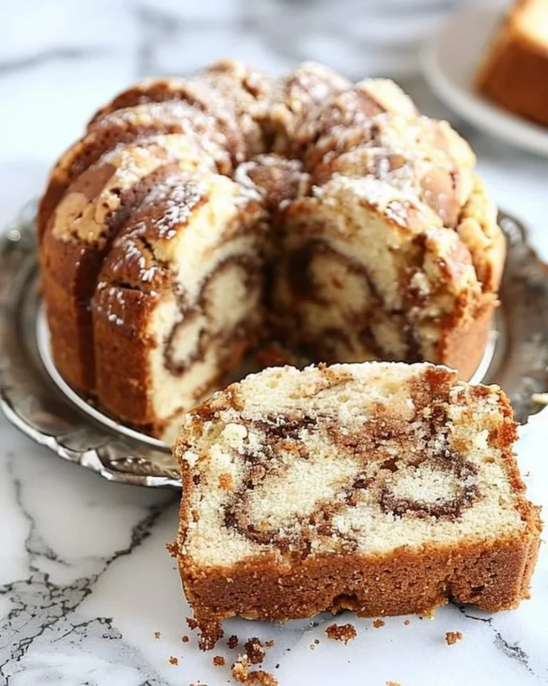 Delicious slice of Cinnamon Swirl Pound Cake with a rich buttery flavor and cinnamon swirl
