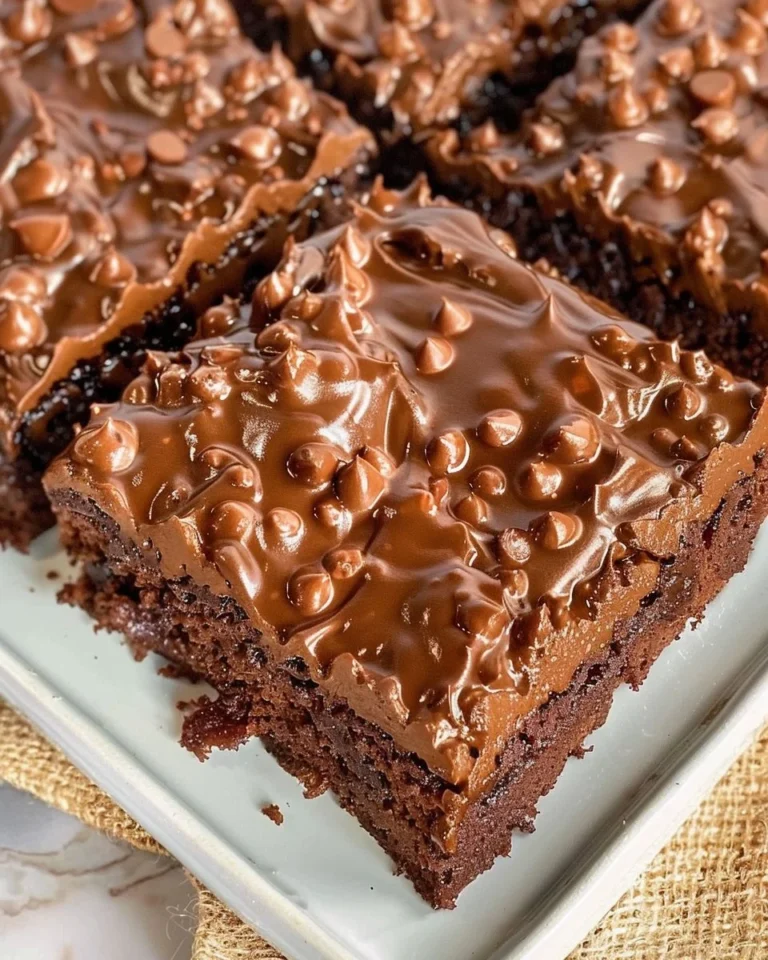 Delicious Dr. Pepper Texas Sheet Cake topped with chocolate icing and nuts.