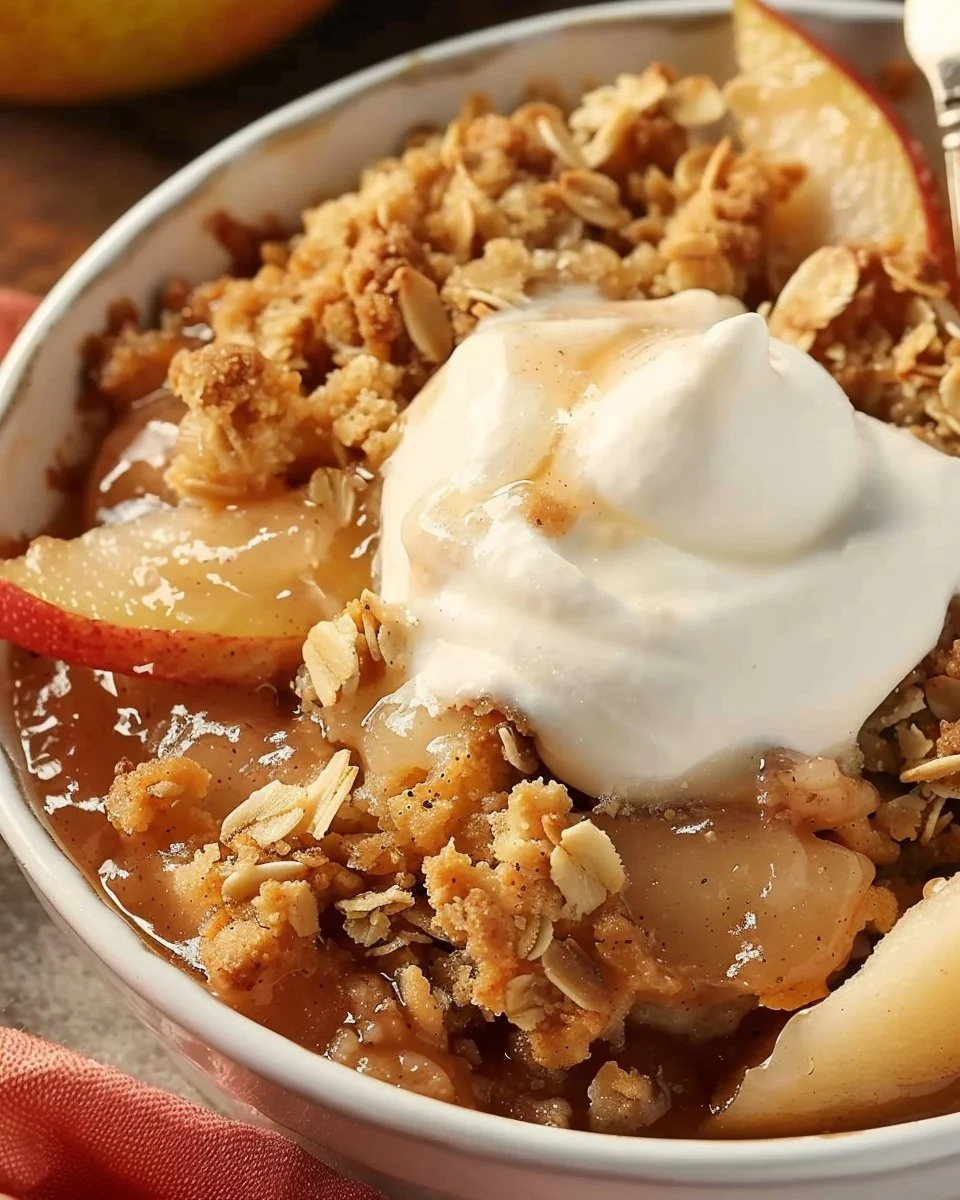 Delicious Apple Pear Crisp dessert topped with crunchy oats and served warm.